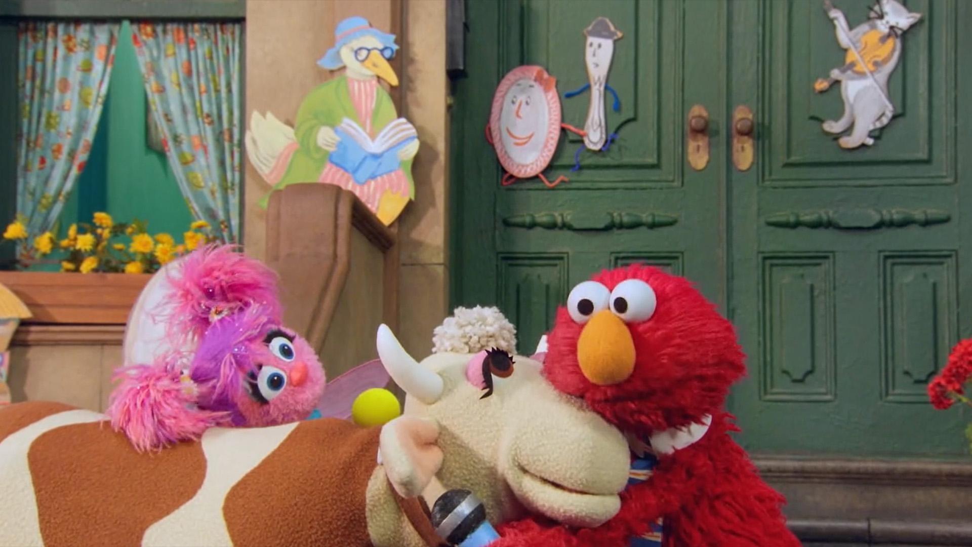 Abby and Elmo help Gladys with her confidence to jump over the moon.