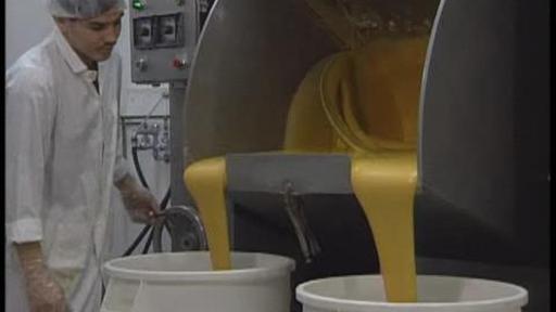 Watch how people make fortune cookies with flour, sugar, eggs, and water.