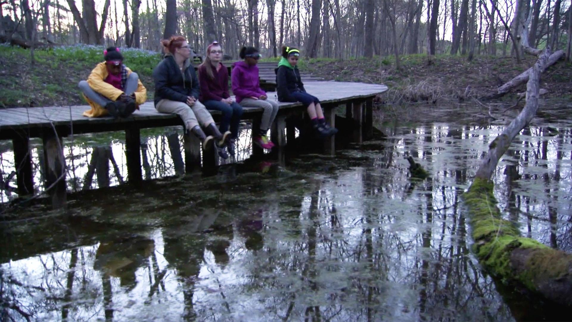 Alanna, Madison, Amanda, and Clara compile a report on their amphibian neighbors.